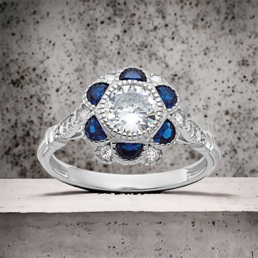 Sterling Silver Rhodium-plated CZ and Synthetic Blue Sapphire Flower Ring